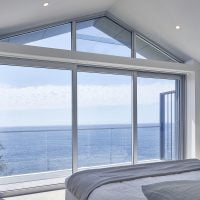 Bondi project: Paragon stacking door and rake window in clear anodised finish